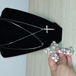 Crosses on a chain,has rhinestones nice,one pendant worn or displayed in window